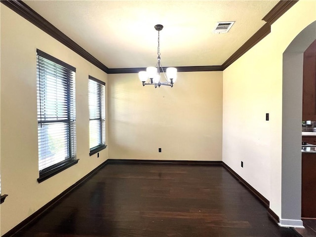 2409 Stone Castle Cir, College Station, TX 77845 - unfurnished dining area with a chandelier, arched walkways, wood finished floors, ornamental molding, and baseboards