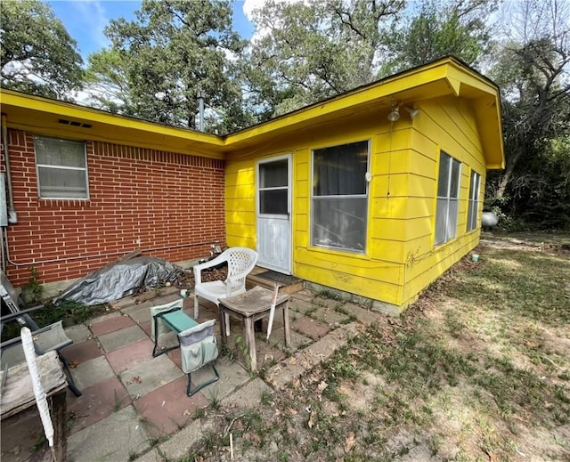 back of property featuring a patio area