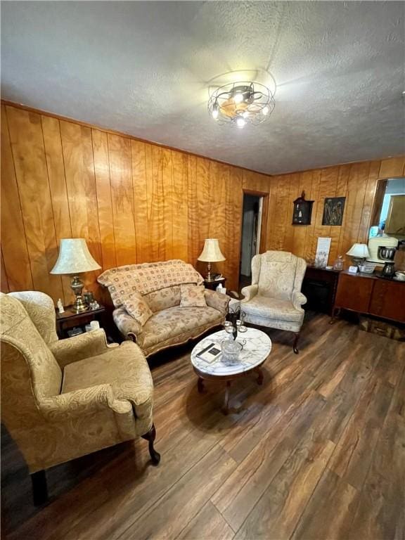 living room featuring hardwood / wood-style flooring and a textured ceiling