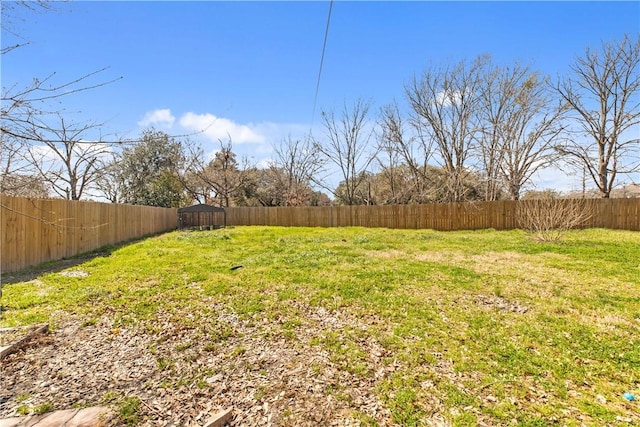 view of yard featuring a fenced backyard