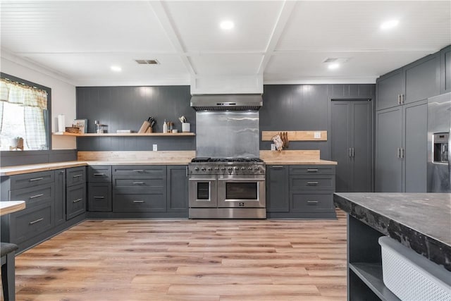 kitchen featuring open shelves, double oven range, and gray cabinets