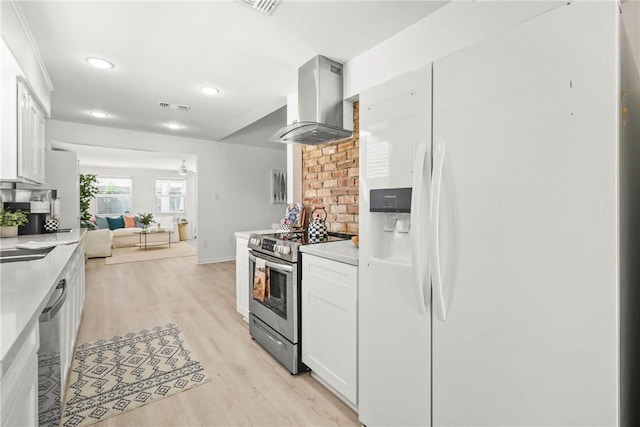 1203 Hawk Tree Dr, College Station, TX 77845 - kitchen with appliances with stainless steel finishes, wall chimney exhaust hood, light wood finished floors, light countertops, and recessed lighting