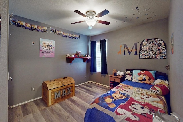 bedroom featuring ceiling fan and hardwood / wood-style floors