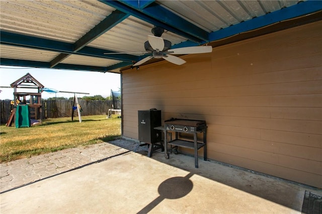 view of patio featuring a playground and ceiling fan