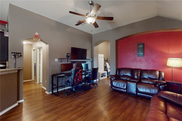 living room featuring dark hardwood / wood-style flooring, ceiling fan, and lofted ceiling