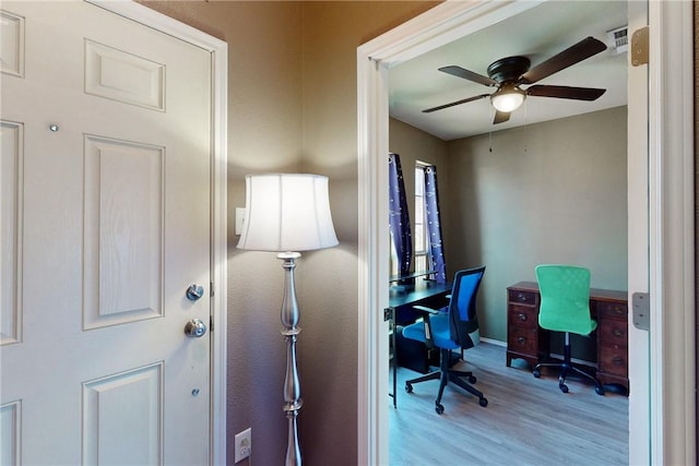 office featuring ceiling fan and light hardwood / wood-style flooring