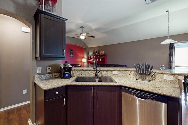 kitchen with stainless steel dishwasher, vaulted ceiling, ceiling fan, sink, and dark hardwood / wood-style floors