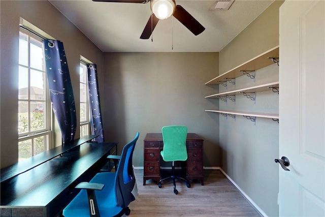 home office featuring ceiling fan and wood-type flooring