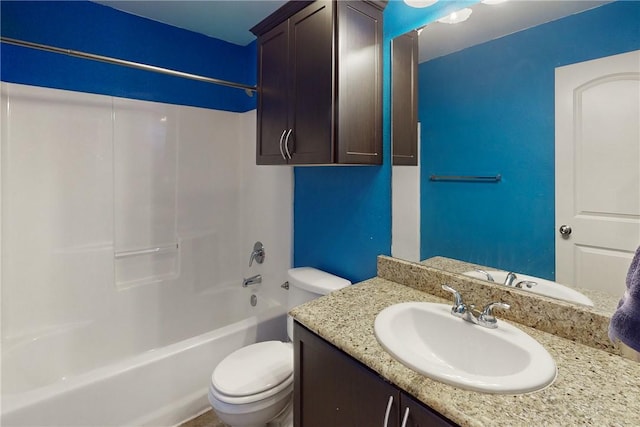 full bathroom featuring vanity, bathing tub / shower combination, and toilet