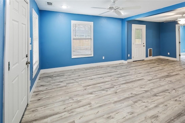 foyer with light hardwood / wood-style floors and ceiling fan