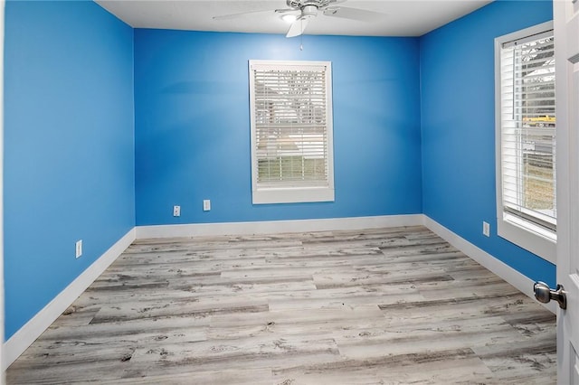 unfurnished room featuring ceiling fan, a healthy amount of sunlight, and light hardwood / wood-style floors