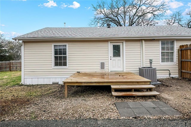 back of house with a wooden deck and central AC