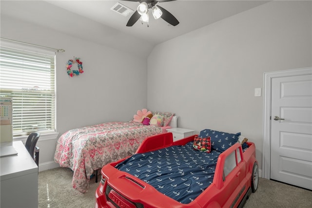 bedroom featuring ceiling fan, carpet floors, and vaulted ceiling