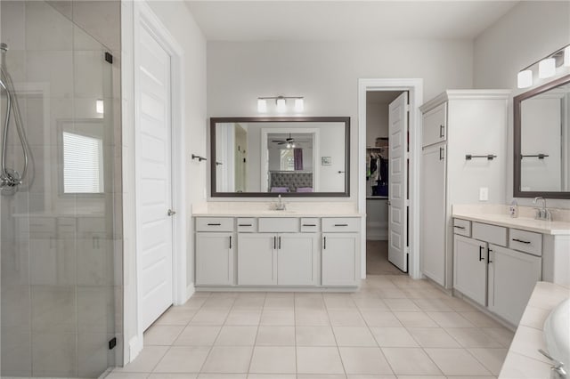 bathroom with tile patterned flooring, vanity, and independent shower and bath