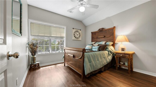 bedroom featuring ceiling fan, dark wood-type flooring, and vaulted ceiling