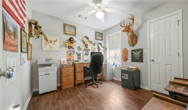 home office with ceiling fan and dark hardwood / wood-style floors