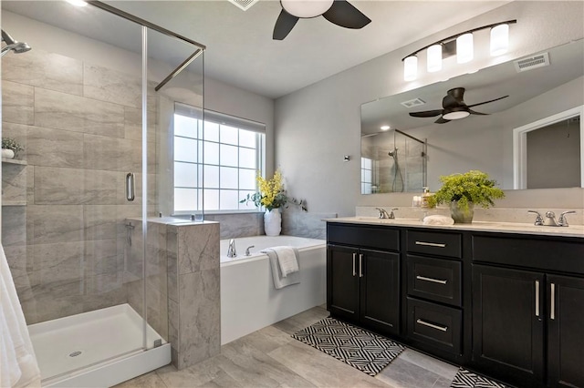 bathroom featuring vanity, ceiling fan, and plus walk in shower