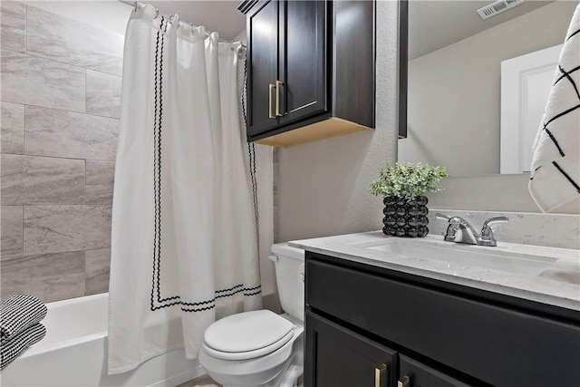 full bathroom featuring vanity, toilet, and shower / bath combo with shower curtain