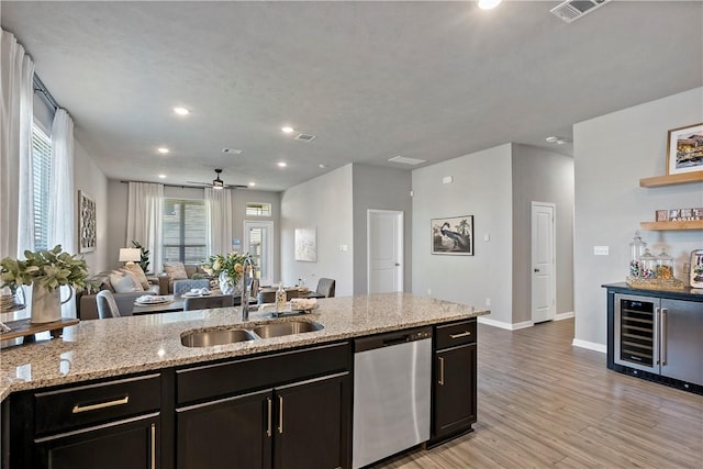 kitchen with dishwasher, sink, light hardwood / wood-style flooring, ceiling fan, and beverage cooler