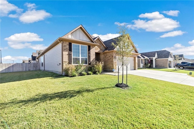 view of front of house with a front yard and a garage