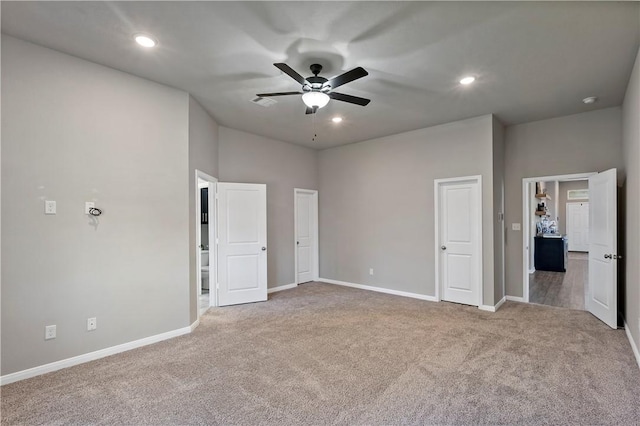 unfurnished bedroom featuring carpet flooring and ceiling fan