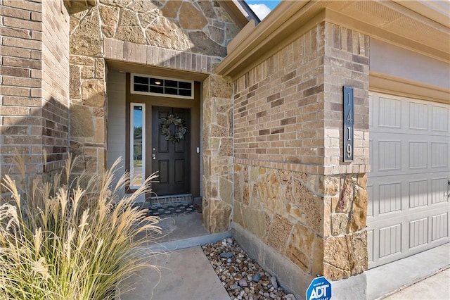 entrance to property featuring a garage