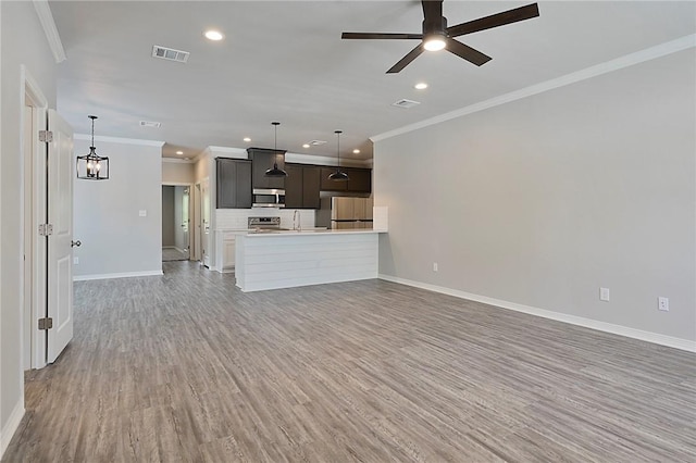 unfurnished living room with baseboards, light wood finished floors, visible vents, and a ceiling fan