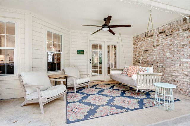 interior space with ceiling fan