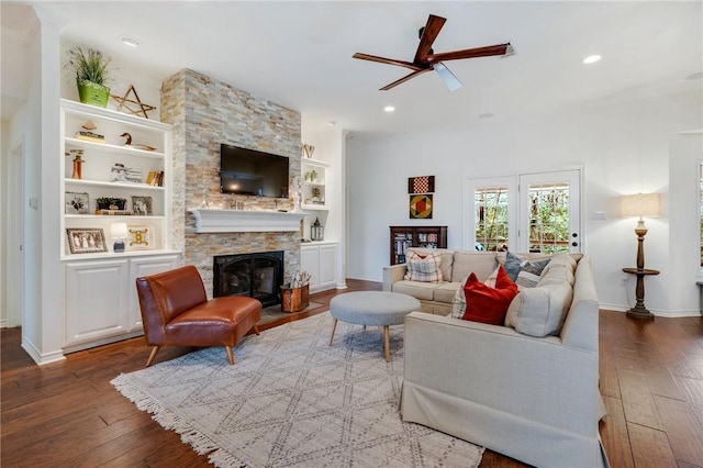 living room with recessed lighting, a fireplace, and hardwood / wood-style flooring