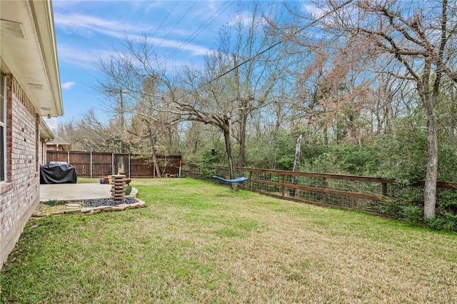 view of yard featuring a fenced backyard and a patio area