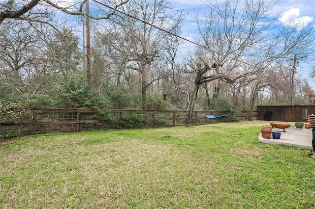 view of yard with an outdoor structure and fence