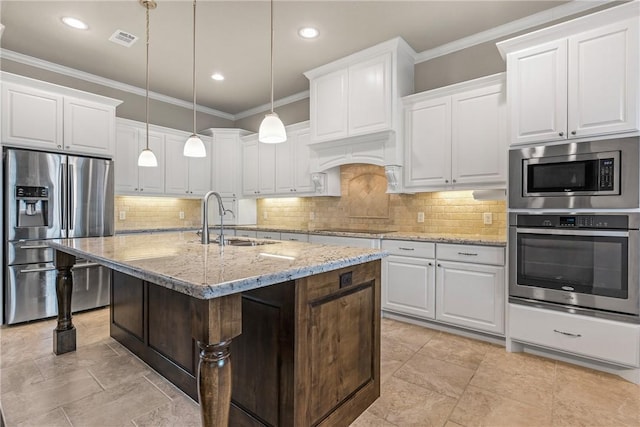 4507 Tonbridge Dr, College Station, TX 77845 - kitchen featuring appliances with stainless steel finishes, a sink, white cabinets, ornamental molding, and recessed lighting