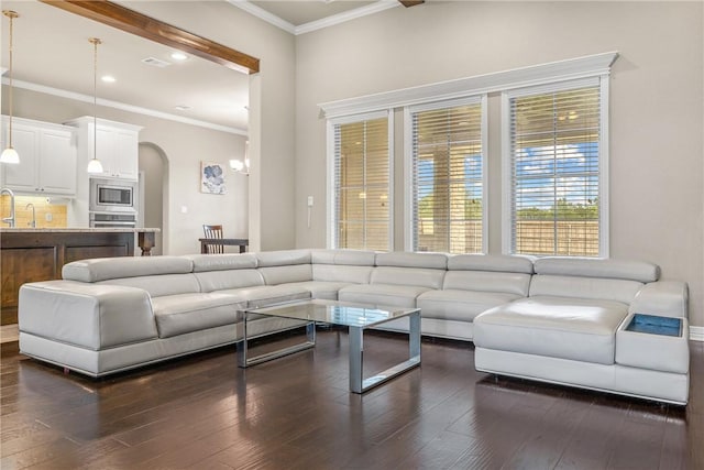4507 Tonbridge Dr, College Station, TX 77845 - living area featuring arched walkways, dark wood-style floors, recessed lighting, and crown molding
