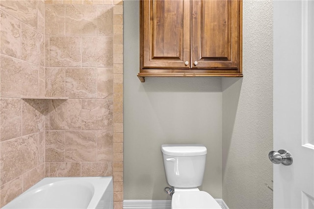 4507 Tonbridge Dr, College Station, TX 77845 - bathroom with toilet, baseboards, and shower / bath combination