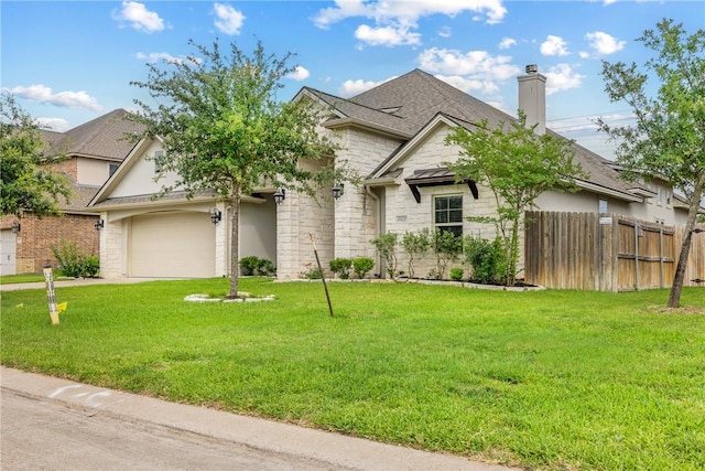 4507 Tonbridge Dr, College Station, TX 77845 - view of front facade with stone siding, a garage, a chimney, roof with shingles, and driveway