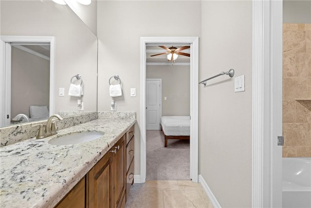 4507 Tonbridge Dr, College Station, TX 77845 - bathroom with connected bathroom, vanity, ornamental molding, ceiling fan, and baseboards