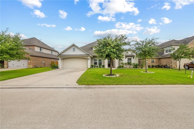 4507 Tonbridge Dr, College Station, TX 77845 - view of front of property with driveway, an attached garage, and a front yard