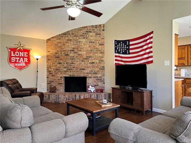 living room featuring lofted ceiling, dark wood-type flooring, a fireplace, and ceiling fan