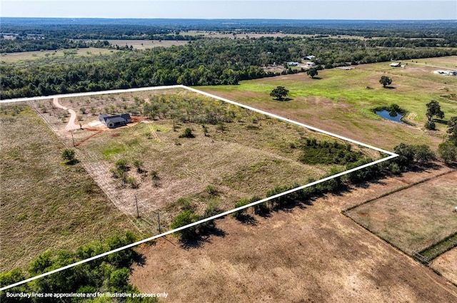 birds eye view of property featuring a rural view