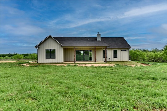 back of house with ceiling fan, a yard, and a patio