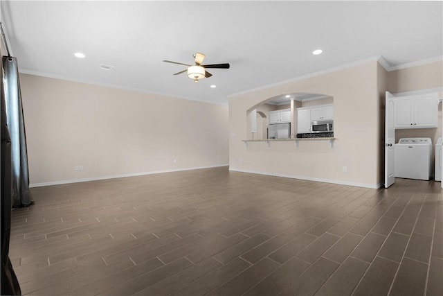 1403 Crescent Ridge Dr, College Station, TX 77845 - unfurnished living room featuring a ceiling fan, separate washer and dryer, crown molding, dark wood-style flooring, and recessed lighting