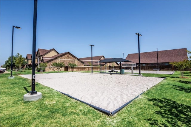 surrounding community with a gazebo, volleyball court, and a lawn