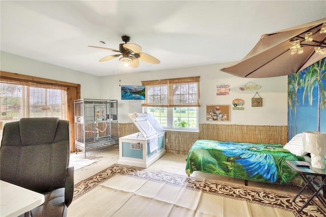 1681 Union Rd, Madisonville, TX 77864 - bedroom featuring a wainscoted wall, a ceiling fan, and wood finished floors