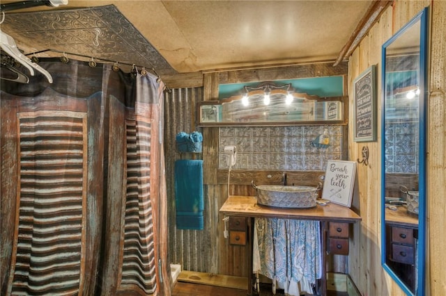 1681 Union Rd, Madisonville, TX 77864 - bathroom featuring vanity and wooden walls