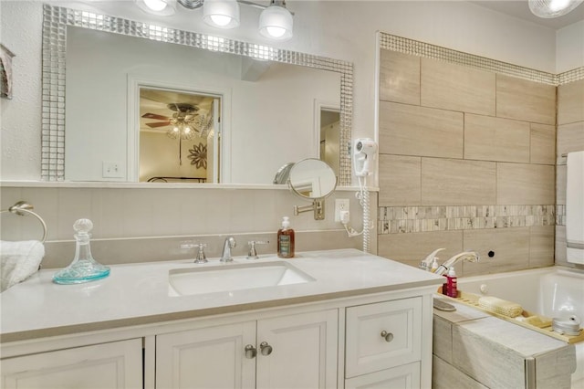 1681 Union Rd, Madisonville, TX 77864 - full bath featuring vanity, tiled tub, and ceiling fan