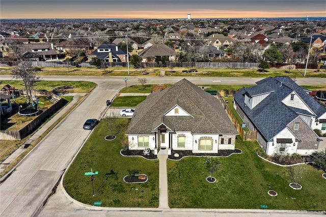 birds eye view of property with a residential view