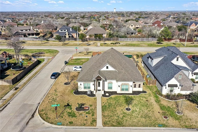 birds eye view of property with a residential view