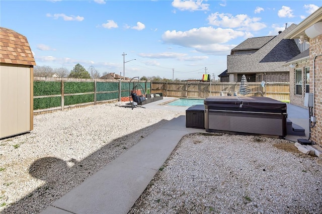 view of patio / terrace featuring a fenced backyard, an outdoor pool, and a hot tub