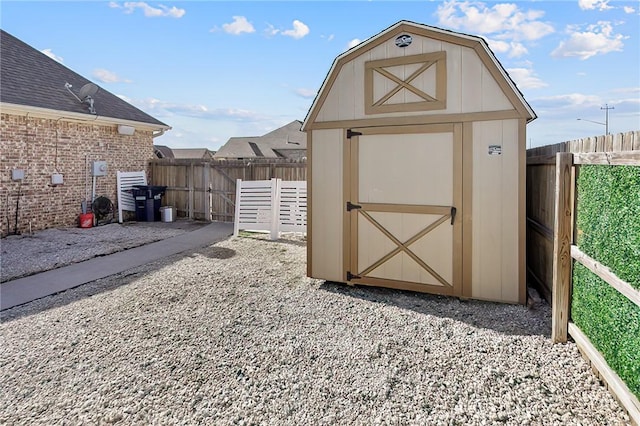 view of shed with a fenced backyard