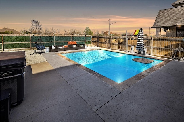 view of swimming pool featuring a patio area, a fenced backyard, and a fenced in pool